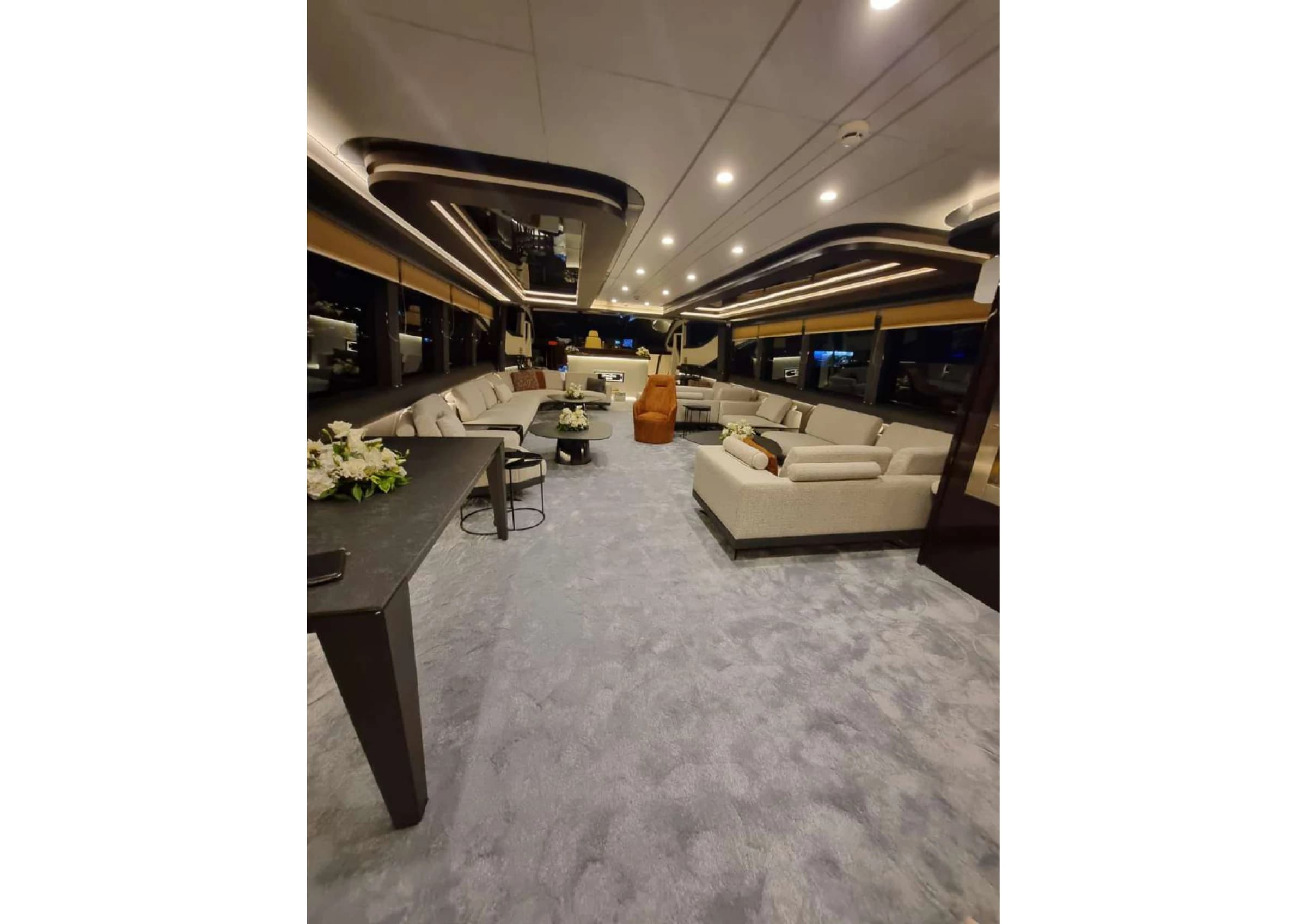 Wide interior view of the main salon lounge on 35m Ultraluxury Yacht