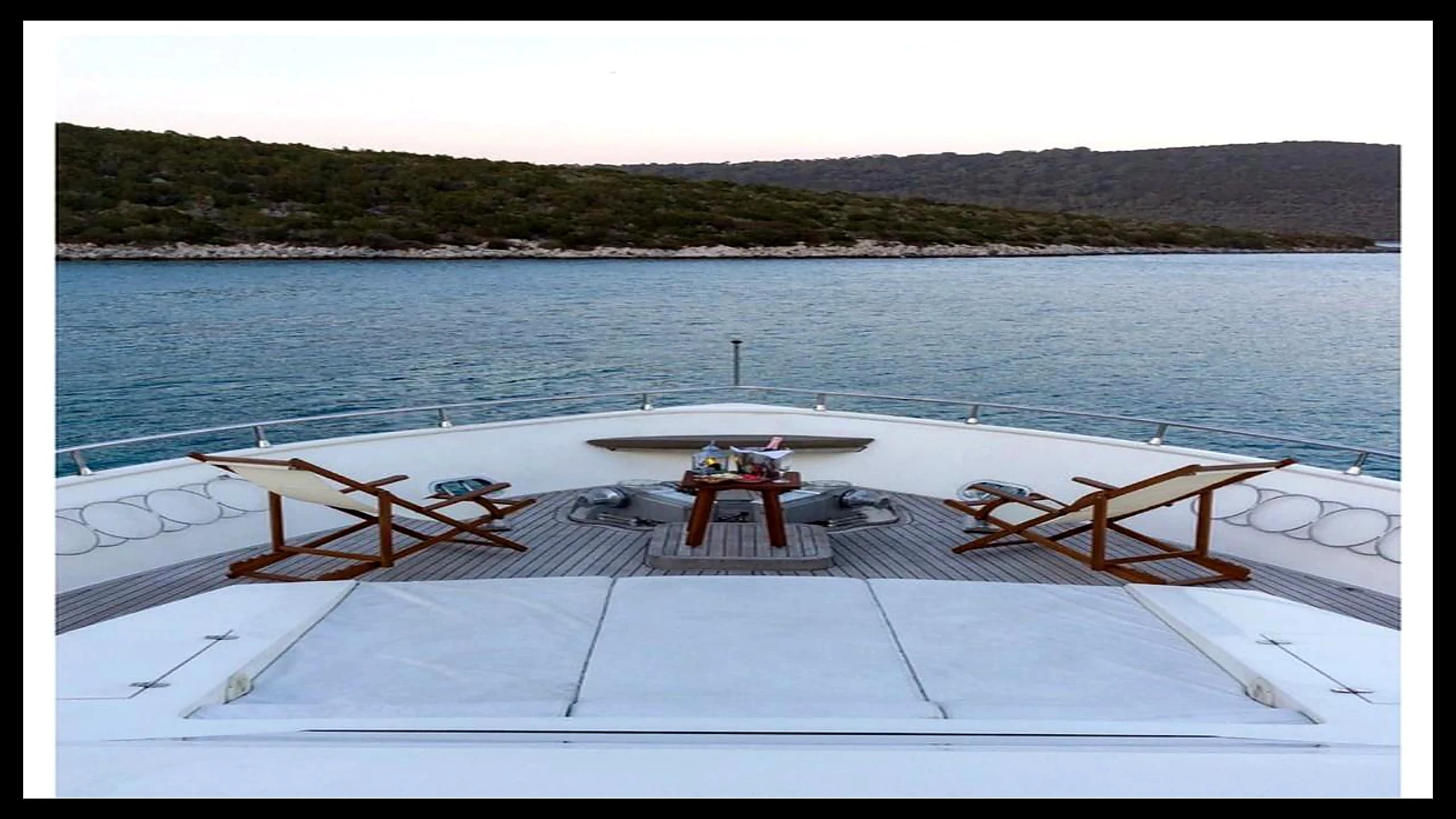 Outdoor deck lounge and sunbed seating area on 27m Yacht