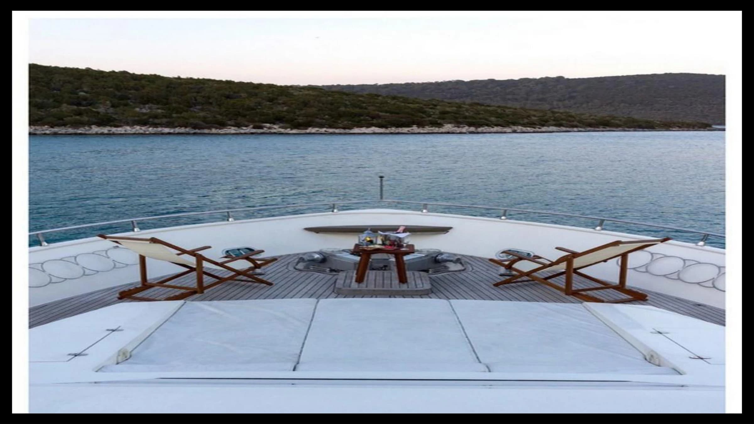 Outdoor deck lounge and sunbed seating area on 27m Yacht