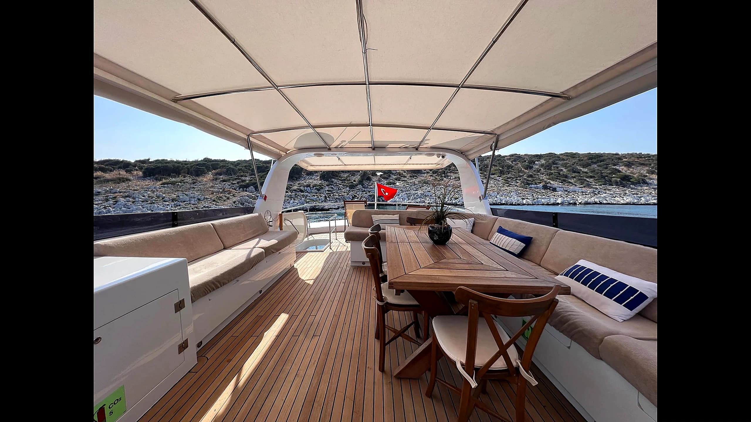 Flybridge upper deck with sunbeds and outdoor seating