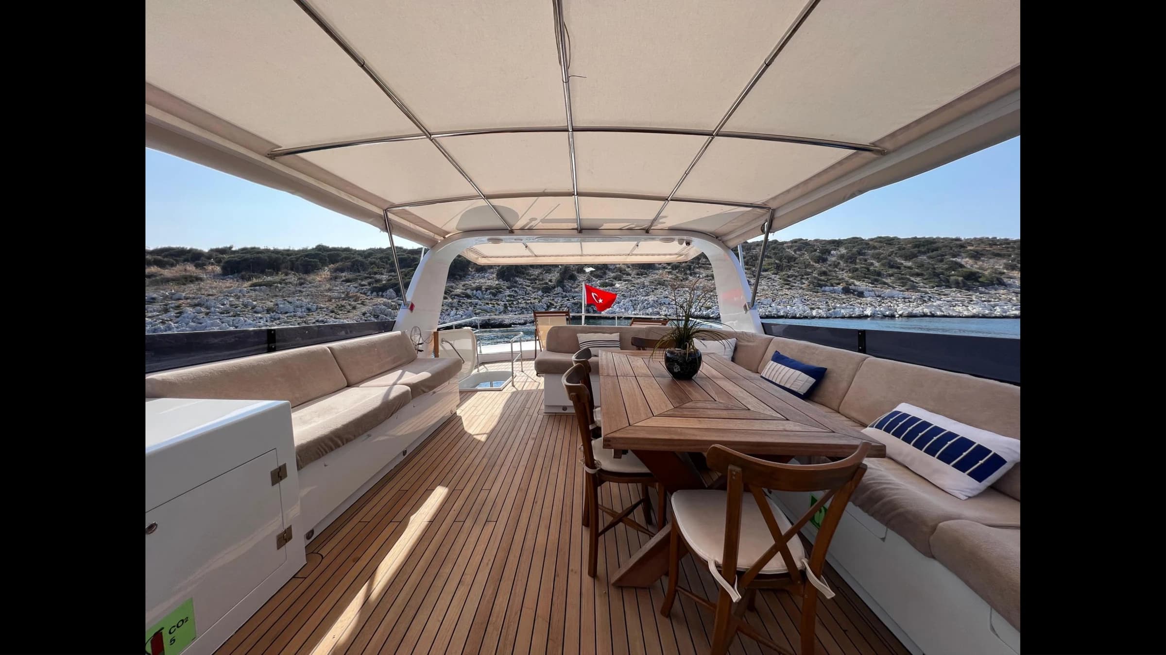 Flybridge upper deck with sunbeds and outdoor seating