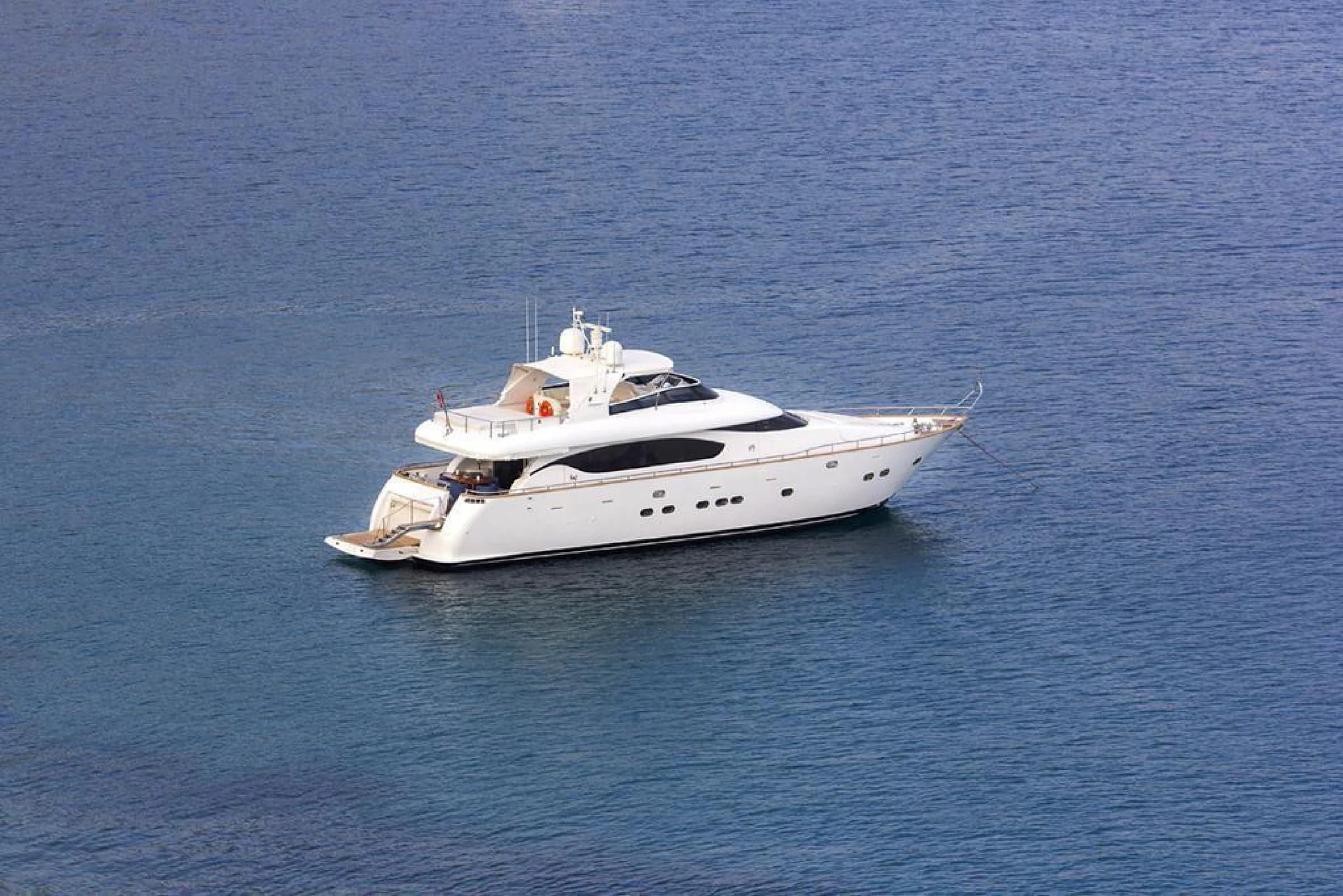 Maiora 24 Luxury Motor Yacht anchored at a scenic Bodrum bay