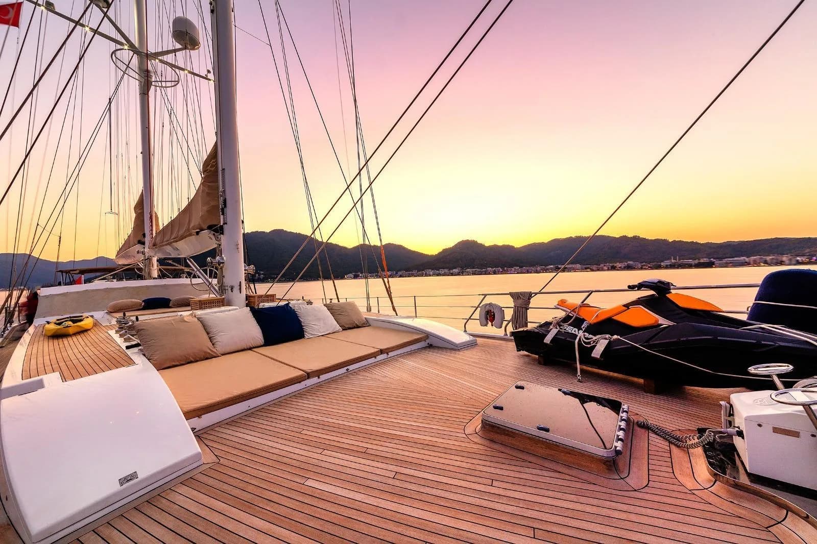 Foredeck sun lounge on the Muka sailing yacht at sunset