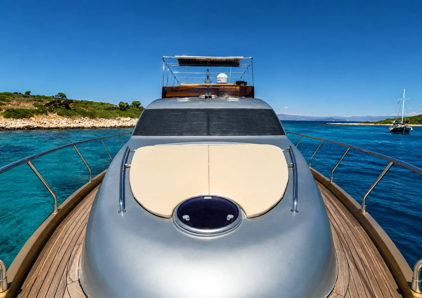 Aft deck lounge seating and dining table on Selenge Motor Yacht