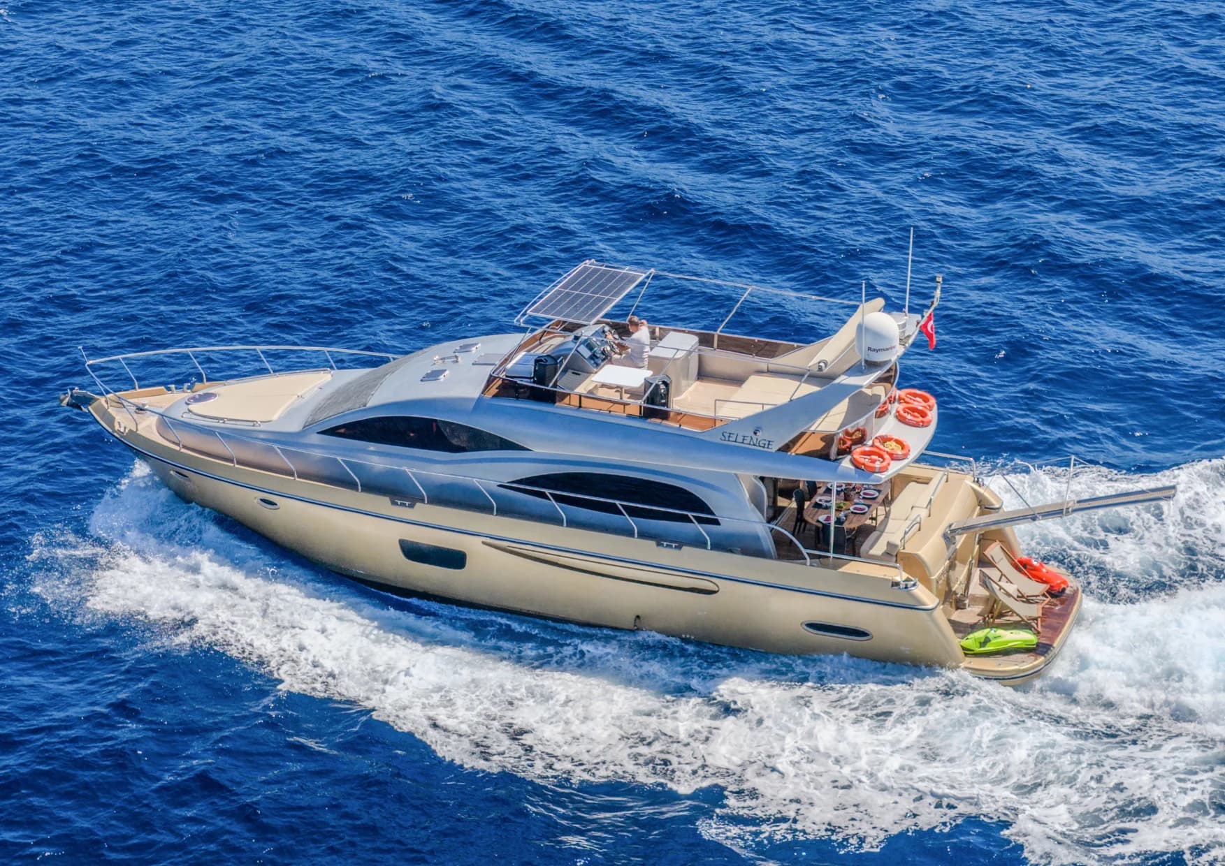 Flybridge upper deck panoramic lounge and steering helm on Selenge