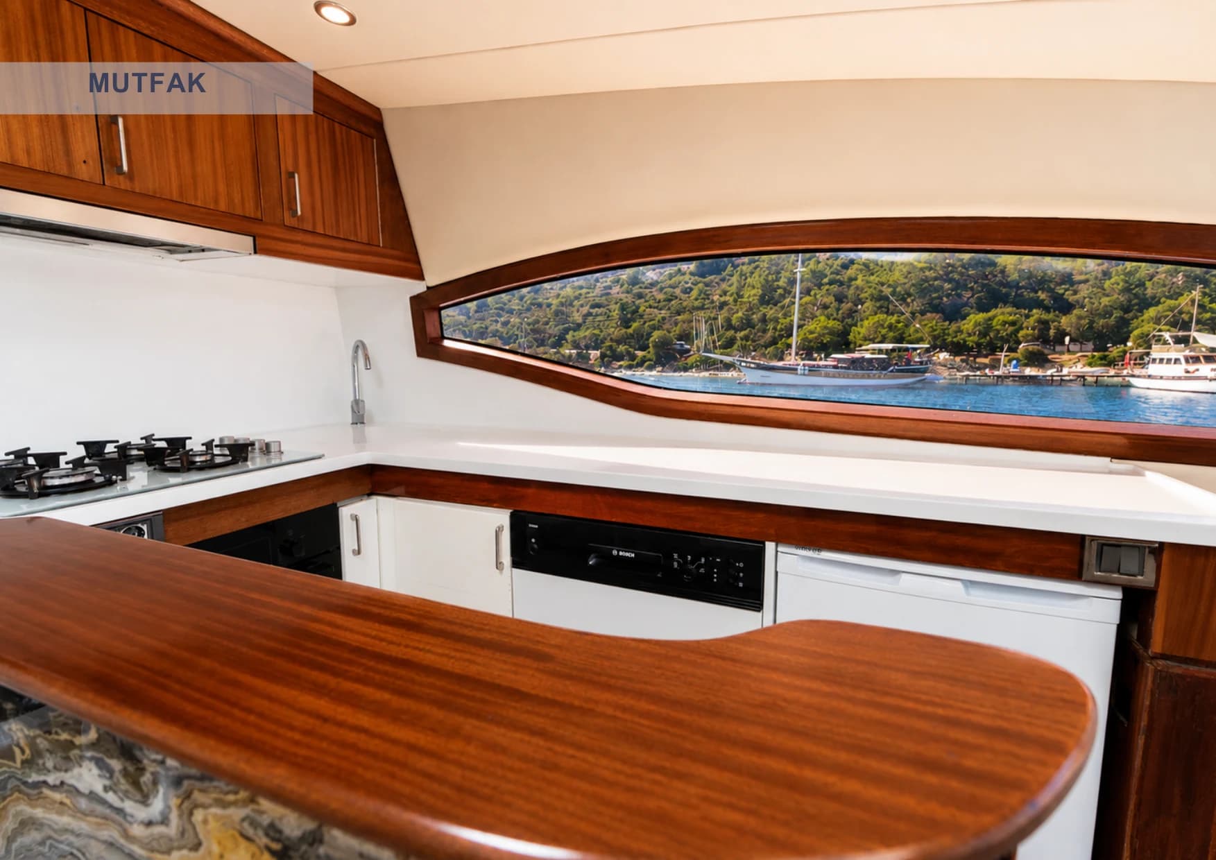 Fully equipped modern galley kitchen with dishwasher and ice maker