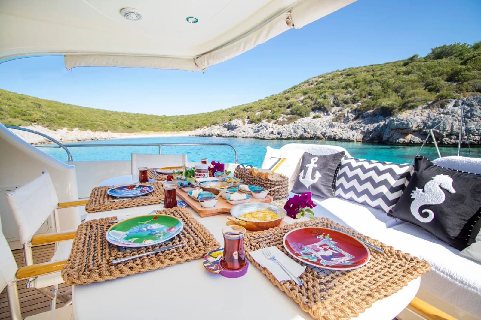Gourmet Alfresco Dining Setup on Aft Deck of ZL Motor Yacht with Sea View