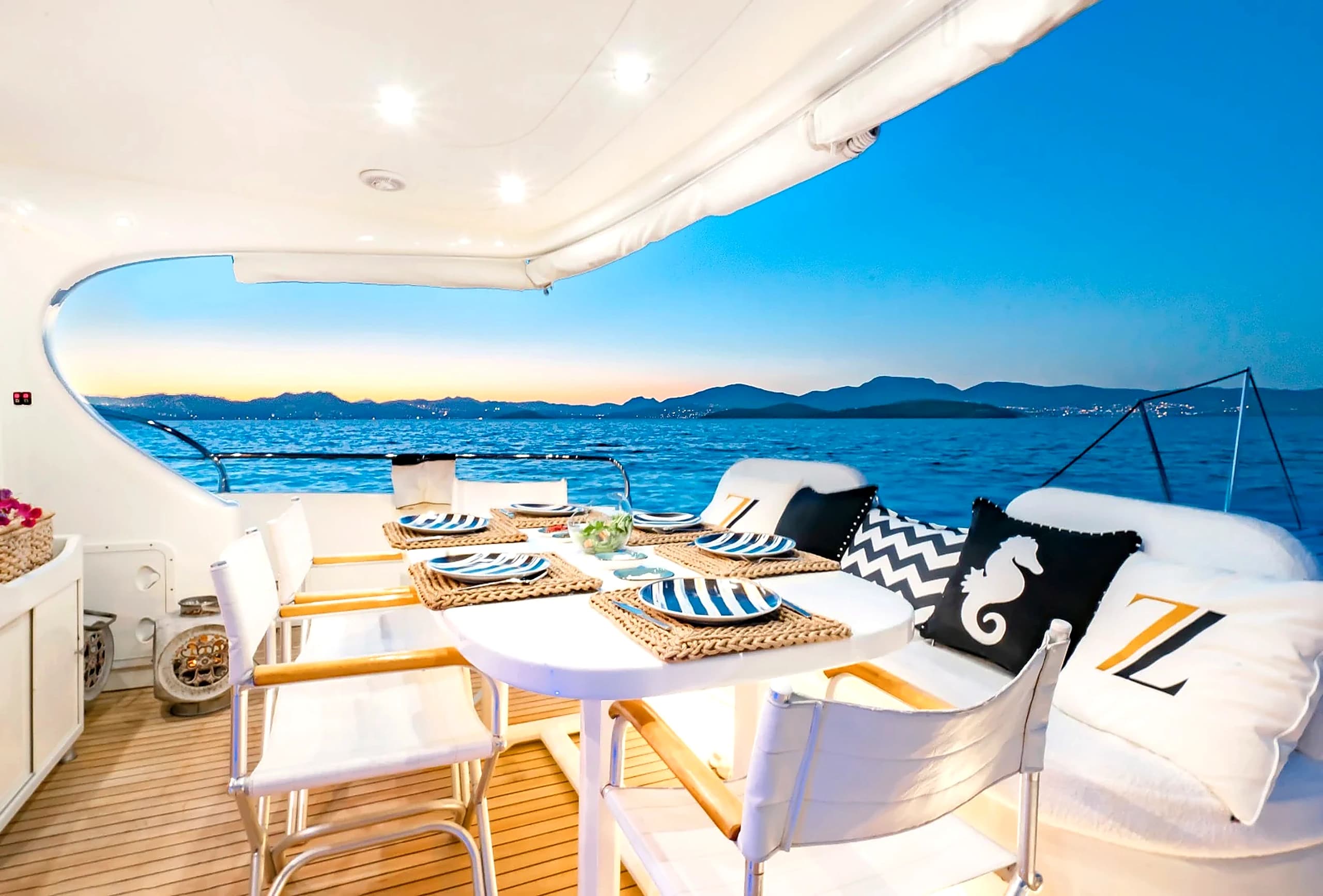 Romantic Evening Dining on ZL Yacht Aft Deck with Aegean Horizon View