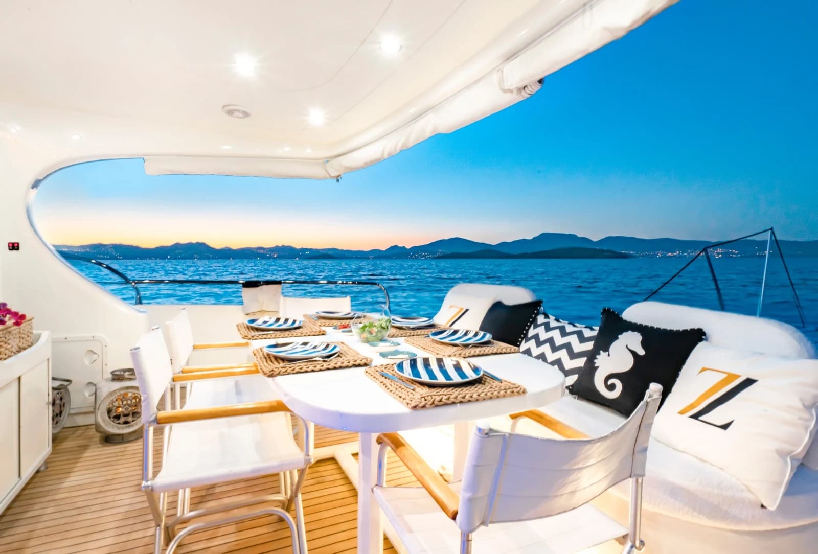 Romantic Evening Dining on ZL Yacht Aft Deck with Aegean Horizon View