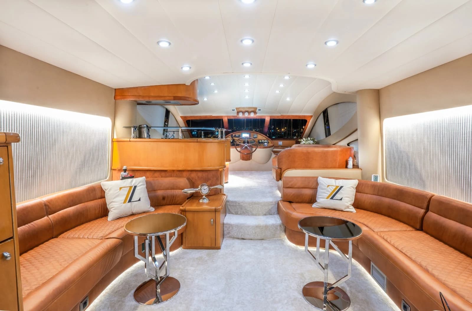 Air-Conditioned Grand Main Salon with Camel Leather U-Sofas and Helm Console