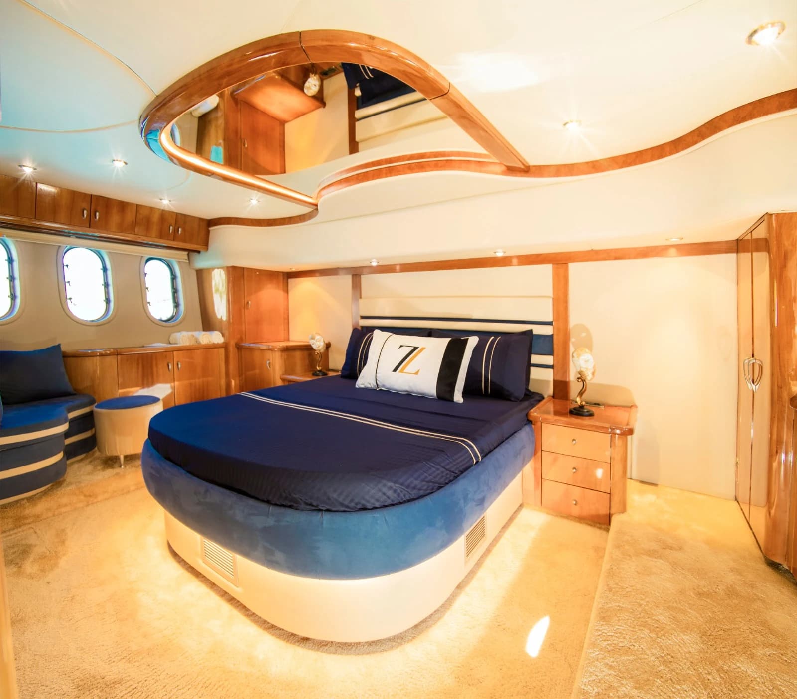 Master Stateroom Featuring Hardwood Trim, Mirror Ceiling and Reading Lights