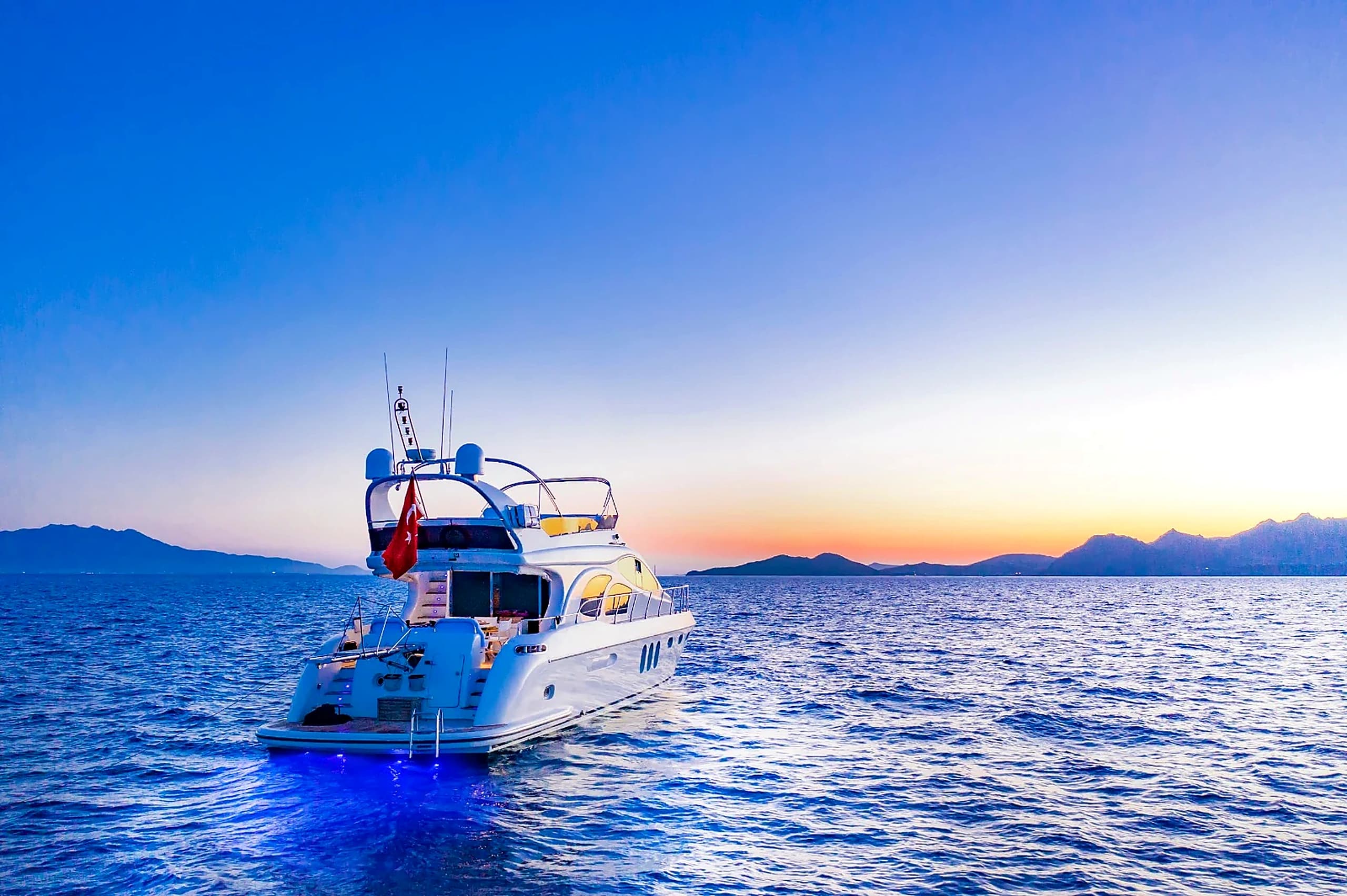 ZL Yacht Stern Deck with Ambient Evening Lighting and Underwater Blue Glow