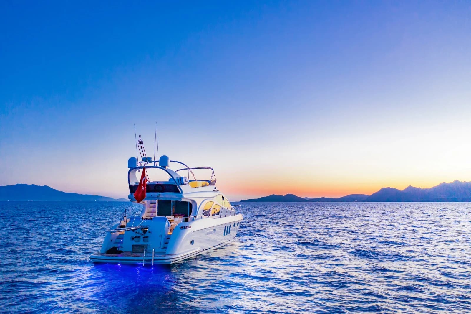 ZL Yacht Stern Deck with Ambient Evening Lighting and Underwater Blue Glow
