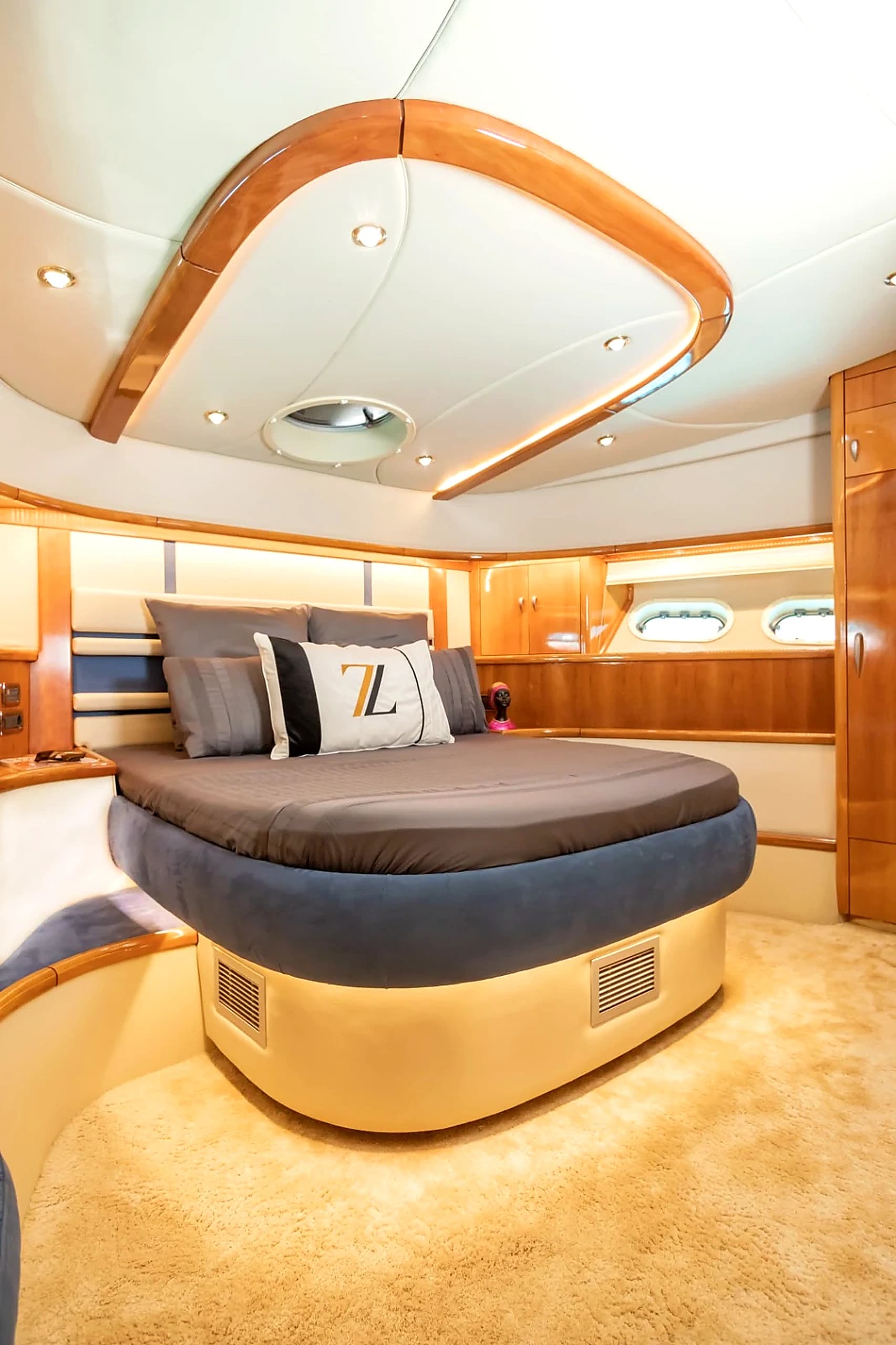 VIP Cabin Double Bed with Custom Monogram Throw Pillows and Ambient LEDs