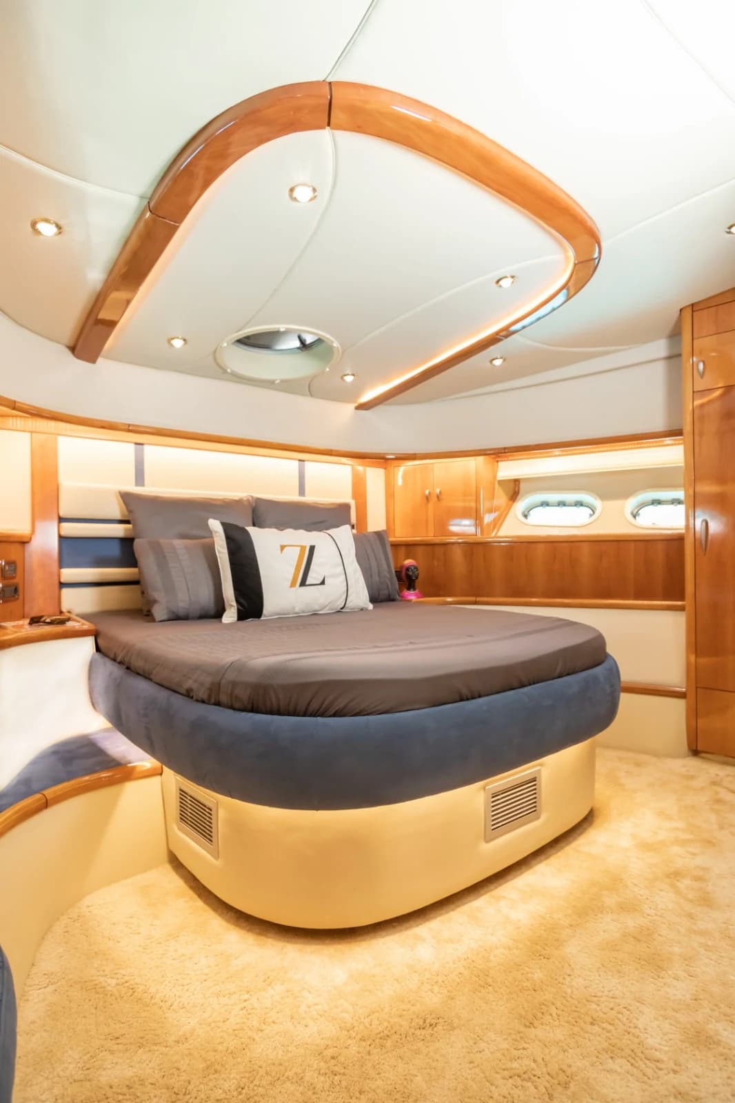 VIP Cabin Double Bed with Custom Monogram Throw Pillows and Ambient LEDs