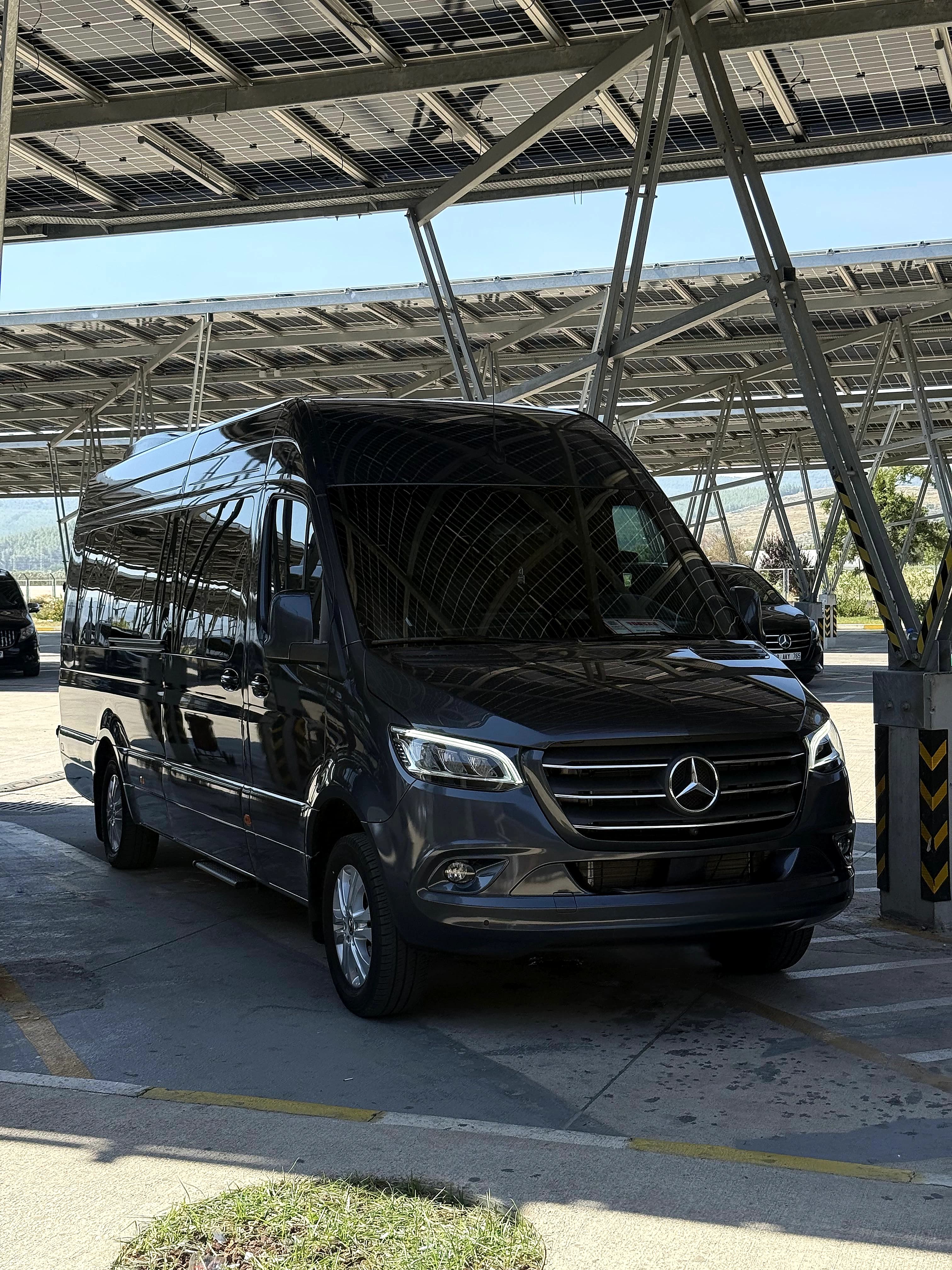 Black luxury Mercedes-Benz Sprinter VIP 10+2 passenger minibus at Yalikavak Marina Bodrum in Bodrum