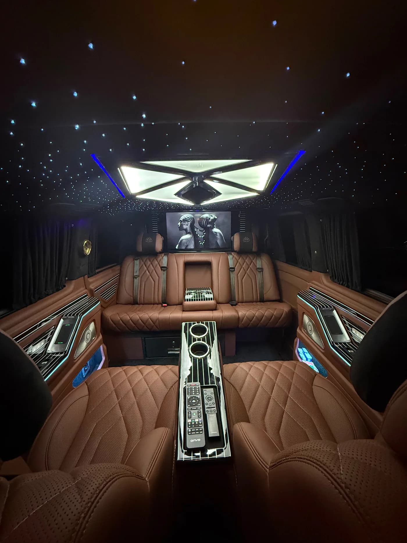 Brown leather VIP V-Class cabin with centre console and starlight ceiling