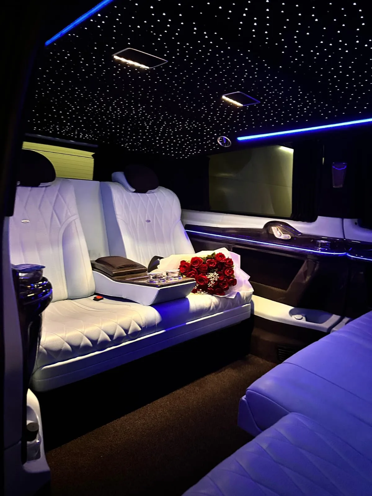 White leather VIP V-Class cabin with individual seats and ambient lighting